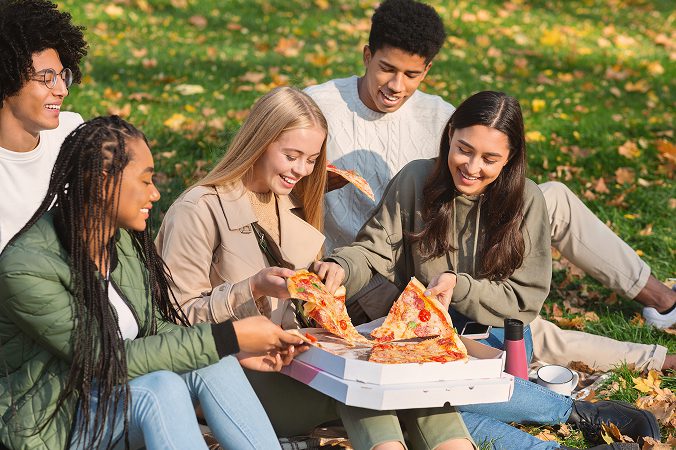 Friends enjoying at the park from Kelowna pizza restaurant Bless'd Sips & Slices