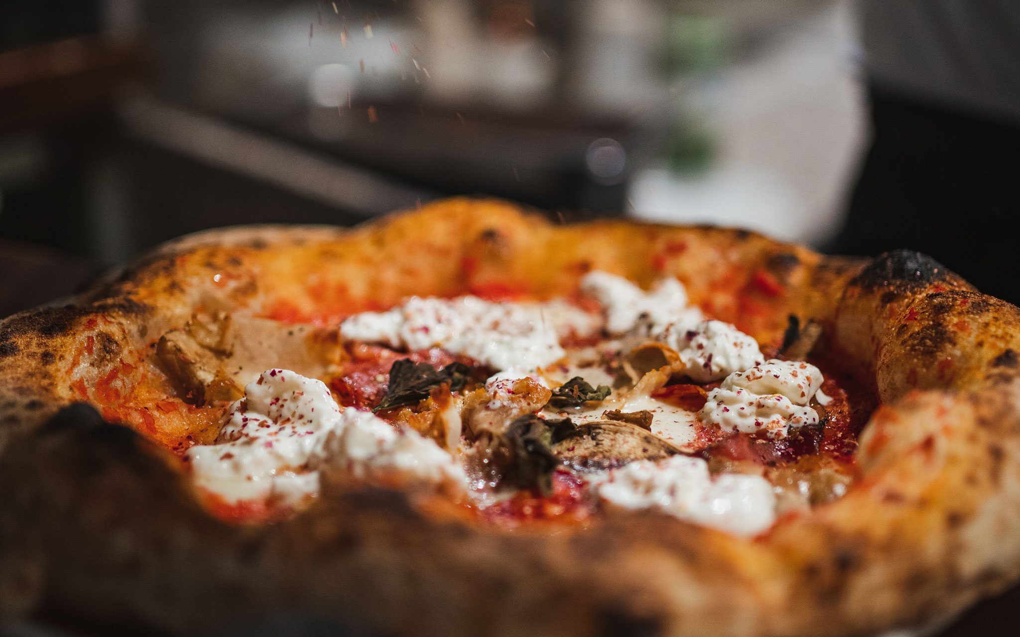 Close up of Kelowna pizza for Bless'd Sips & Slices